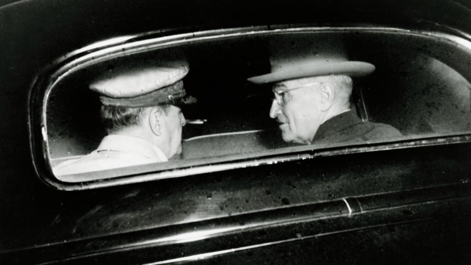 U.S. military commander General Douglas MacArthur (1880 - 1964) and U.S. President Harry S. Truman (1884 - 1972) as they talk in the back seat of a car in Wake Island, October 18 1950.