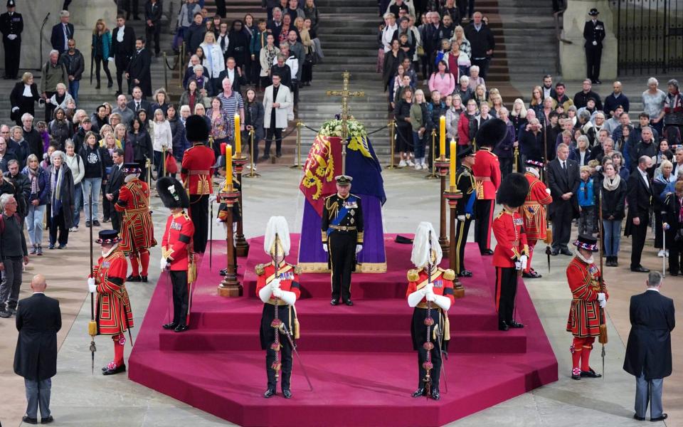 As mourners continued to file past the catafalque, all four of the Queen's children paid their respects in a sombre show of public grief - Yui Mok/Pool Photo via AP