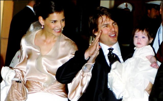 ITALY – NOVEMBER 16: Tom Cruise and Katie Holmes in Rome for wedding. Cruise and Holmes are expected to marry in the Orsini Odescalchi Castle in the lakeside town of Bracciano just 60 kilometers from the capital on november 18th. Tom Cruise ,Katie Holmes with their daughter Suri arrive at the restaurant ‘Nino’ near plaza di Spagna, where Tom Cruise, Katie Holmes and their guests had dinner in Rome, Italy on November 16, 2006. (Photo by Eric VANDEVILLE/Gamma-Rapho via Getty Images)