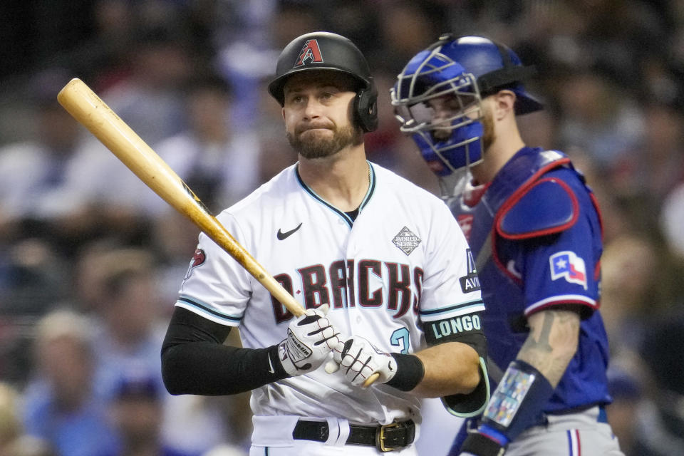 Arizona Diamondbacks' Evan Longoria reacts after striking out against the Texas Rangers during the third inning in Game 3 of the baseball World Series Monday, Oct. 30, 2023, in Phoenix. (AP Photo/Godofredo A. Vásquez)