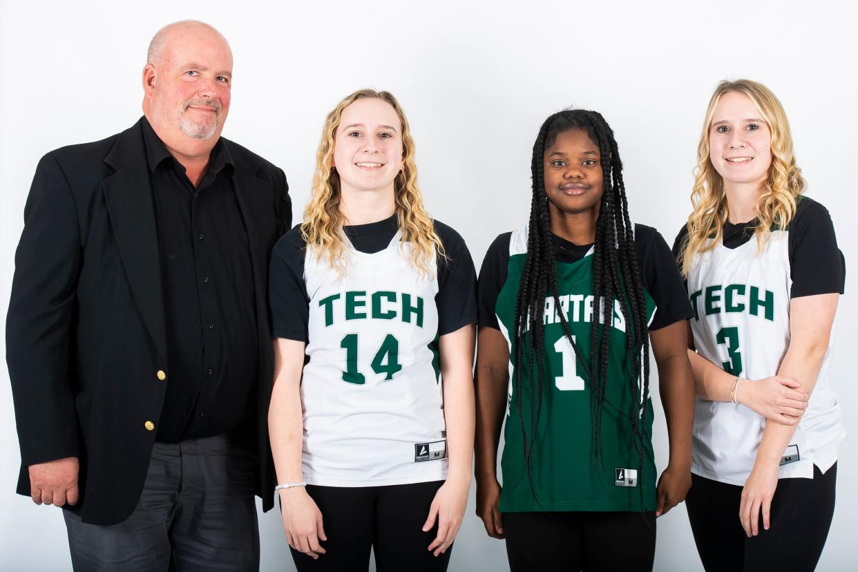 (From left) York Tech basketball head coach John Glass poses for a photo with players Brooke Foster, Le’Icessess Harrison and Anna Foster during YAIAA winter sports media days Wednesday, November 8, 2023, in York.