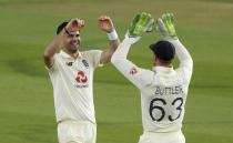 England's James Anderson, left, celebrates with teammate Jos Buttler the dismissal of Pakistan's captain Azhar Ali during the first day of the second cricket Test match between England and Pakistan, at the Ageas Bowl in Southampton, England, Thursday, Aug. 13, 2020. (Stu Forster/Pool via AP)