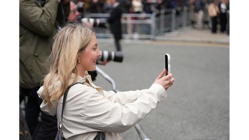 A photo of Isabelle holding an iphone