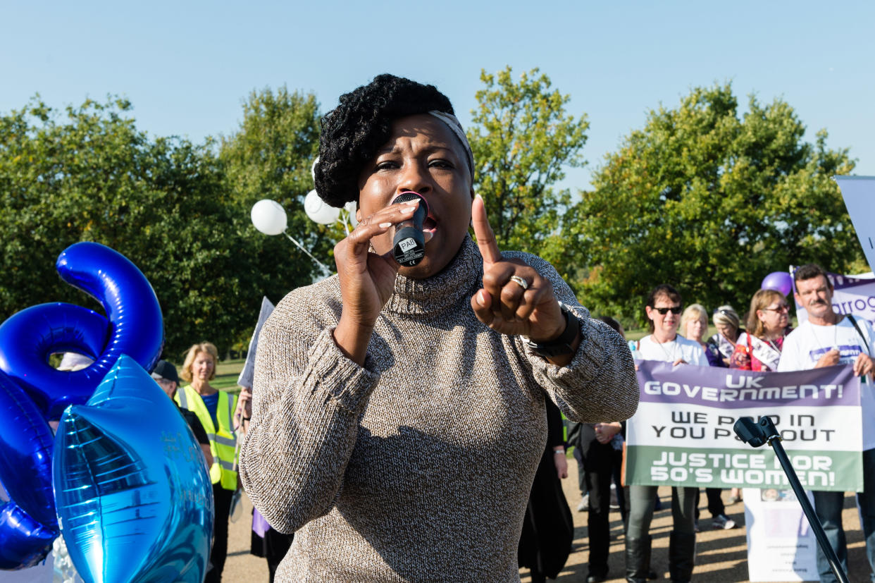 LONDON, UNITED KINGDOM - OCTOBER 10: Women's Rights Activist Dr. Shola Mos-Shogbamimu addresses a rally in Londons Hyde Park against governments implementation of pensions age equalisation policy, which increased the female state pension age from 60 to 66. Protesters call for fair transitional state pension arrangements as the current policy changes affect an estimated 3.9 million women who have to wait up to an extra six years to receive their pensions. October 10, 2018 in London, England. (Photo credit should read Wiktor Szymanowicz / Barcroft Media via Getty Images)