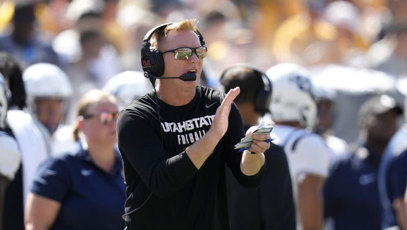 Utah State head coach Blake Anderson watches from the sideline during the first half of an NCAA college football game against Iowa, Saturday, Sept. 2, 2023, in Iowa City, Iowa. 