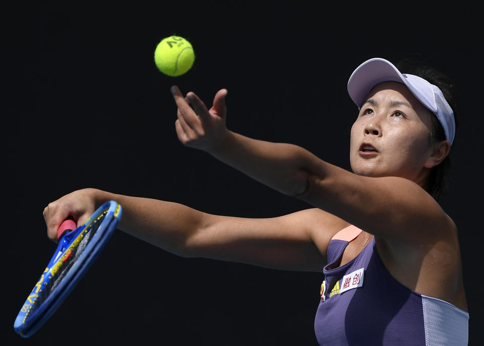 FILE - China's Peng Shuai serves to Japan's Nao Hibino during their first round singles match at the Australian Open tennis championship in Melbourne, Australia, on Jan. 21, 2020. China's Foreign Ministry is sticking to its line that it isn't aware of the controversy surrounding tennis professional Peng Shuai, who disappeared after accusing a former top official of sexually assaulting her. A ministry spokesperson said Friday that the matter was not a diplomatic question and that he was not aware of the situation. (AP Photo/Andy Brownbill, File)