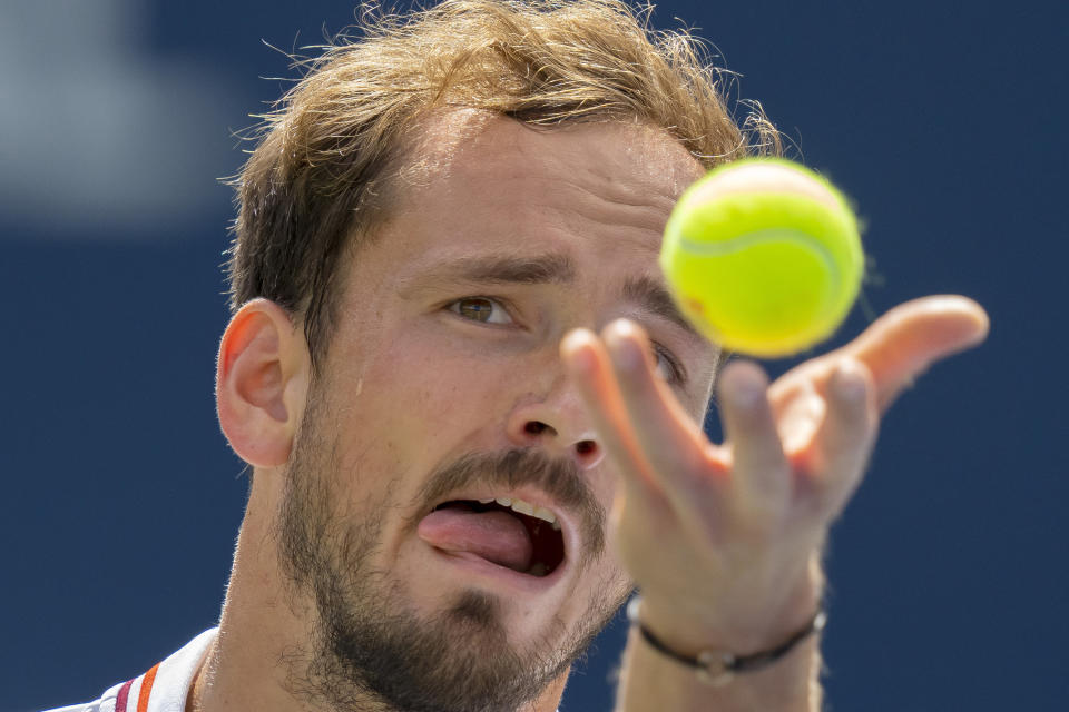 Daniil Medvedev, of Russia, tosses the ball to serve to Alex de Minaur, of Australia, in a match at the National Bank Open tennis tournament in Toronto, Friday, Aug. 11, 2023. (Frank Gunn/The Canadian Press via AP)
