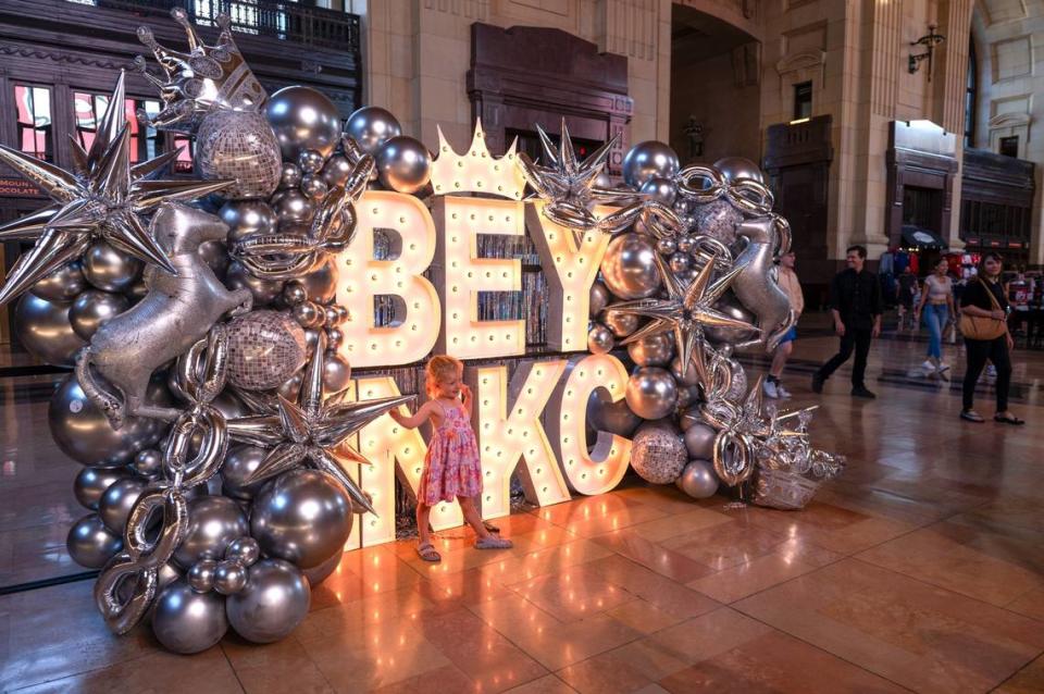 Faith East poses for a photograph in front of the Beyoncé themed sign at Union Station.
