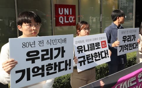 South Korean protesters denounce Uniqlo - Credit: AFP/YONHAP