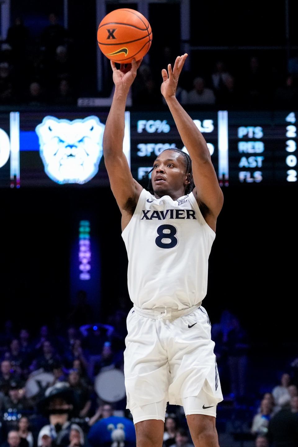 Xavier Musketeers guard Quincy Olivari (8) shoots from three point range in the second half of the NCAA Big East basketball game between the Xavier Musketeers and the Butler Bulldogs at the Cintas Center in Cincinnati on Tuesday, Jan. 16, 2024. The Musketeers won 85-71.