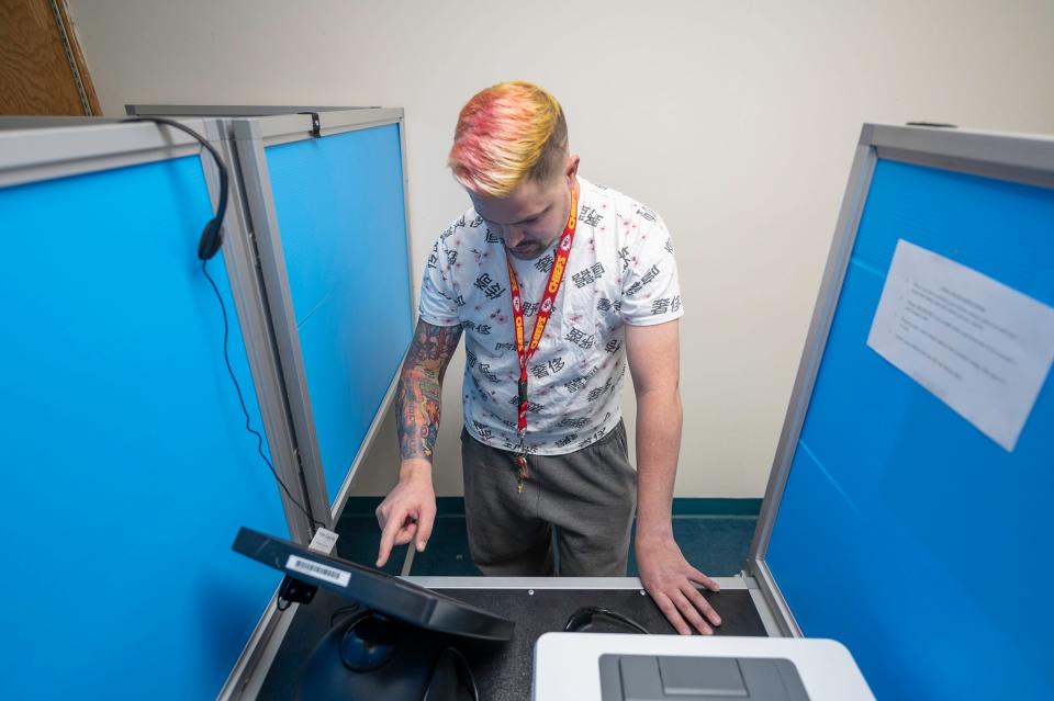 Daniel Brogan casts his ballot for the 2022 midterm election at the Pueblo County Elections Department on Thursday, Nov. 3, 2022.