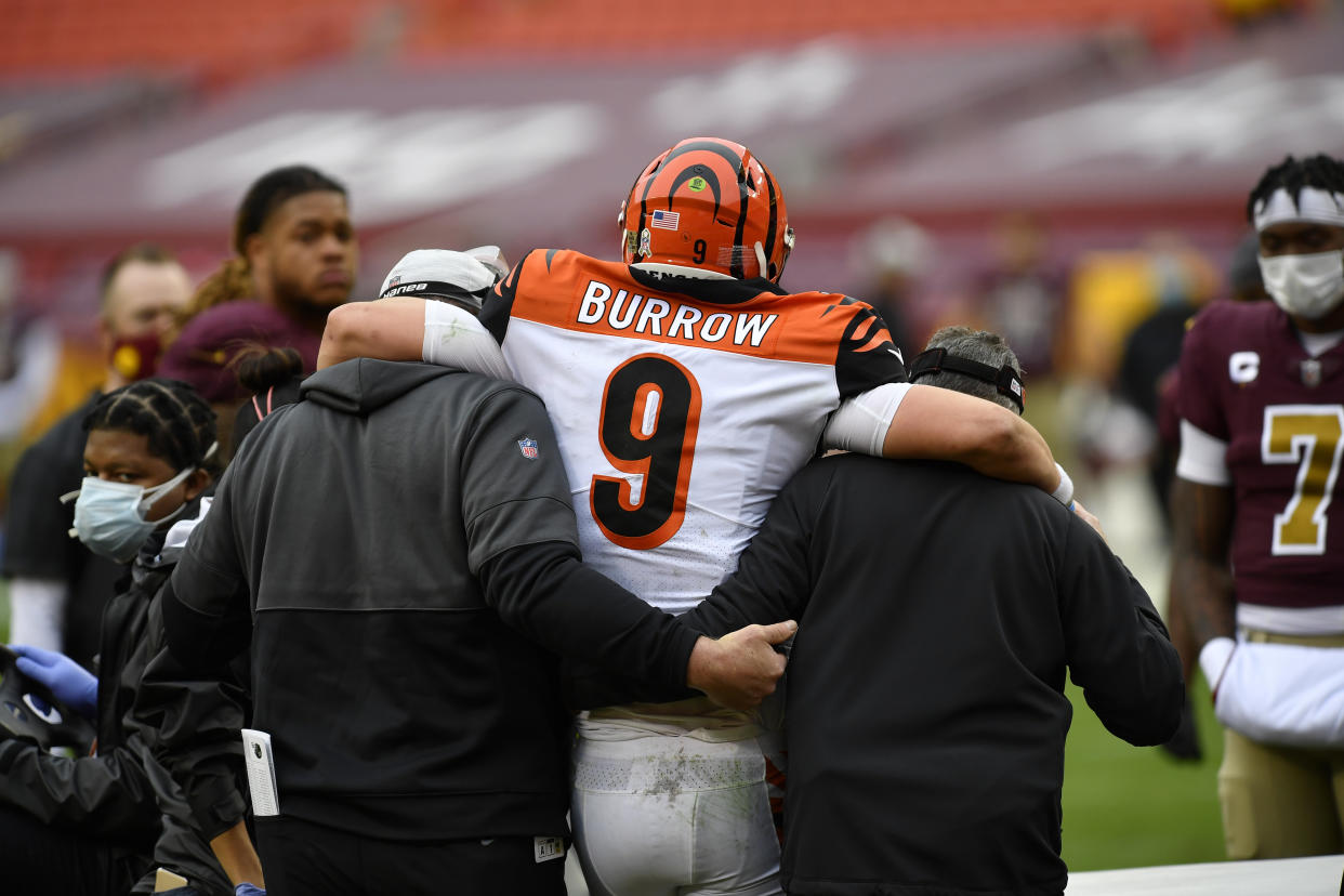 Whoever takes Trevor Lawrence or Justin Fields, this draft's prized quarterbacks, would be wise to learn from the mistakes the Bengals made with Joe Burrow. (Photo by Randy Litzinger/Icon Sportswire via Getty Images)