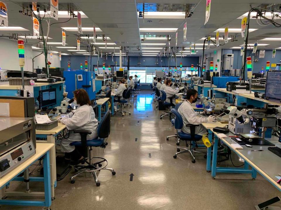 Honeywell will add 2,200 workers from its $2 billion acquisition of CAES Systems Holdings. CAES employees work on radio-frequency technology at one of its manufacturing facilities.