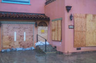 A boarded up house on Beach Drive in Aptos, Calif., Monday, Jan. 9, 2023. (AP Photo/Nic Coury)