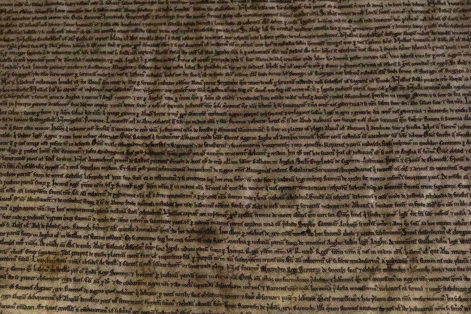 Detail from the Salisbury Magna Carta is seen as it is displayed to mark the 800th anniversary of the sealing of the Magna Carta in 1215, in the Queen's Robing Room at the Houses of Parliament in London February 5, 2015. The original copies were displayed on Thursday for one day at the opening of the exhibition "Magna Carta and Parliament". REUTERS/Matt Dunham/pool (BRITAIN - Tags: POLITICS SOCIETY)