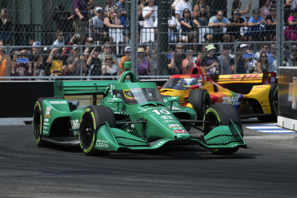 Alex Palou (10) makes a turn during the IndyCar Detroit Grand Prix auto race in Detroit, Sunday, June 4, 2023. (AP Photo/Paul Sancya)