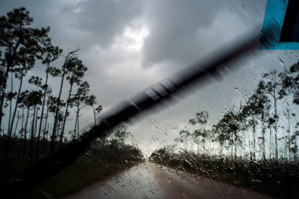 A car returns to the capital before the arrival of Hurricane Dorian in Freeport, Grand Bahama, Bahamas, Sept. 1, 2019. | Ramon Espinosa—AP