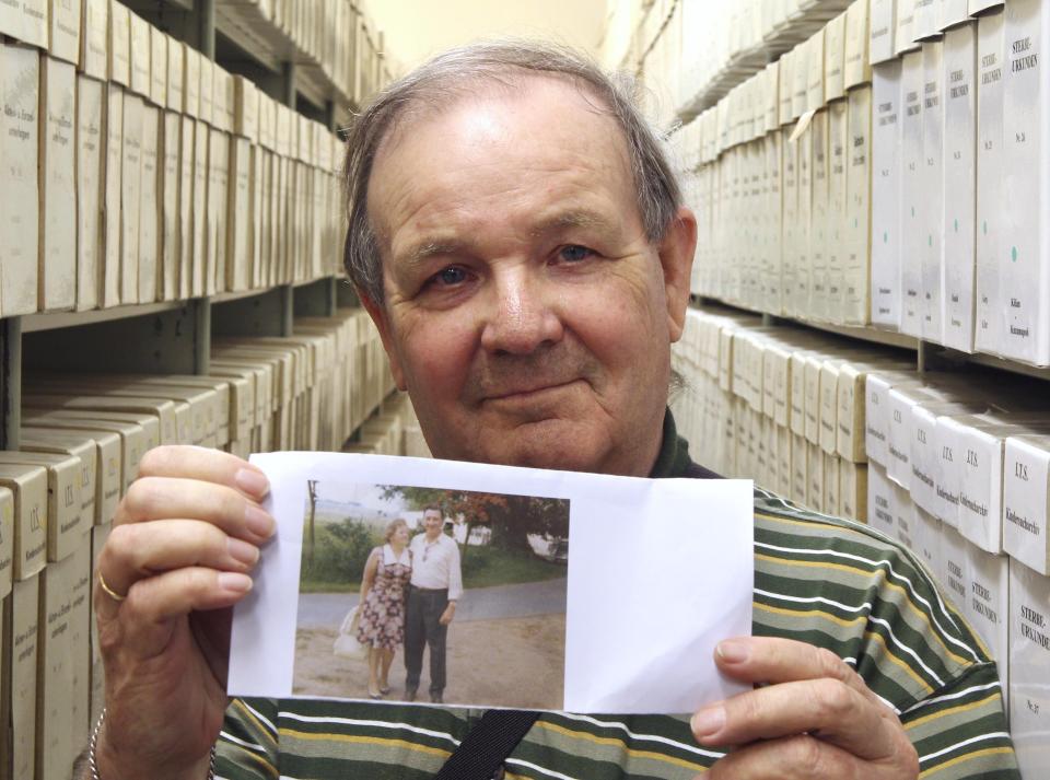 George Jaunzemis, 69, who was separated from his mother in the final days of World War II, displays a photograph showing his parents at the International Tracing Service in Bad Arolsen, Germany, on Thursday, May 19, 2011 after discovering his true identity. (Michael Probst)