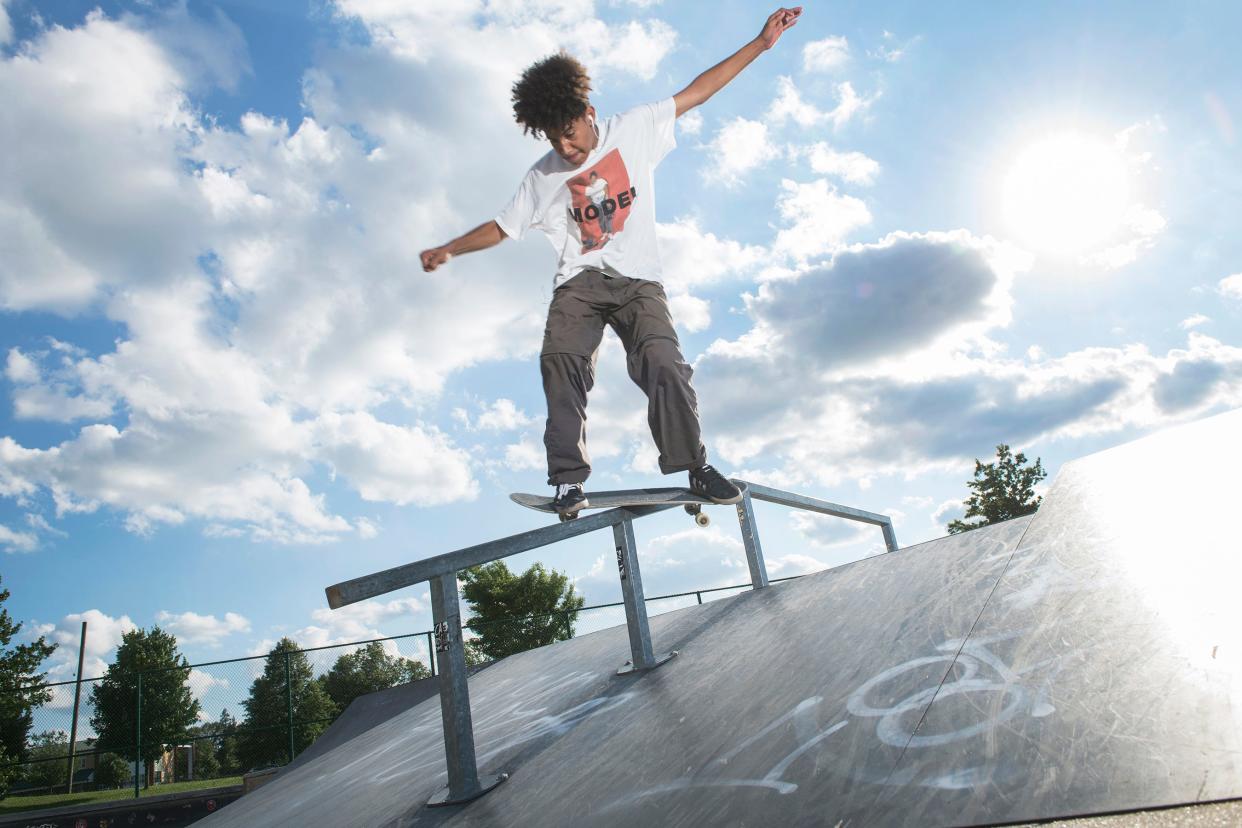 Wander Peralta of Pennsauken slides down a rail while skateboarding at the Pennsauken skate park on Tuesday, June 15, 2021.