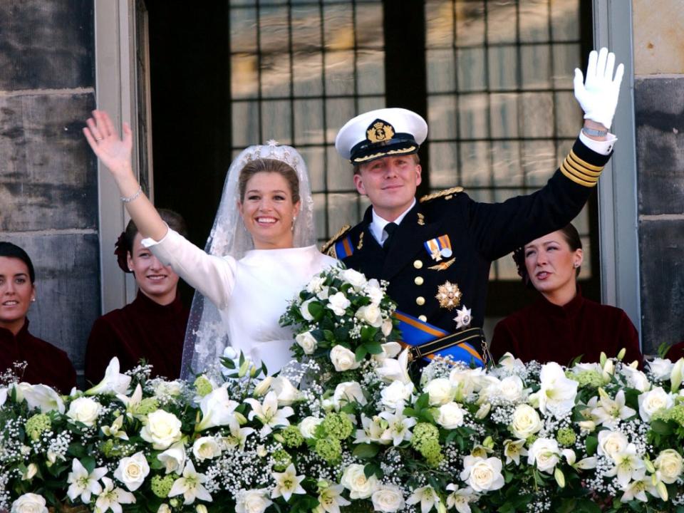 King Willem-Alexander and Queen Máxima of the Netherlands on the balcony of the Royal Palace in Amsterdam on 2 February, 2002 (Anthony Harvey/Getty)