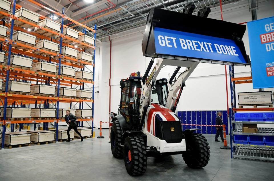 The stunt involved him driving the digger which had a 'Get Brexit done' sign in the bucket (REUTERS)