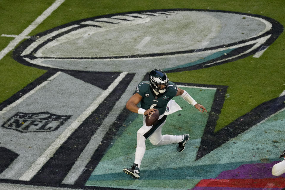 Philadelphia Eagles quarterback Jalen Hurts (1) scrambles against the Kansas City Chiefs during the first half of the NFL Super Bowl 57 football game, Sunday, Feb. 12, 2023, in Glendale, Ariz. (AP Photo/Charlie Riedel)