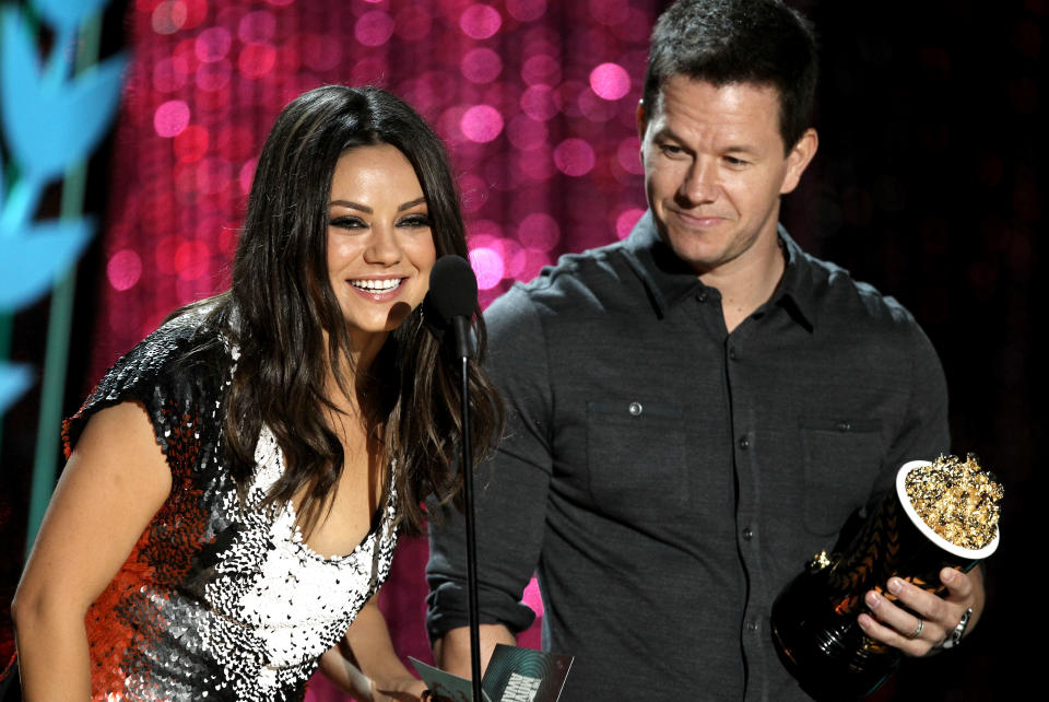 Mila Kunis, left and Mark Wahlberg present the award for best on-screen dirtbag at the MTV Movie Awards on Sunday, June 3, 2012 in Los Angeles. (Photo by Matt Sayles/Invision/AP)