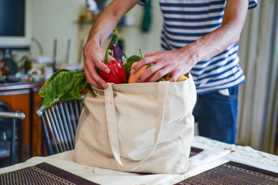 Man unpacking groceries