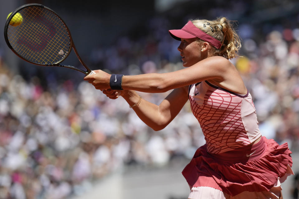 Russia's Mirra Andreeva plays a shot against Coco Gauff of the U.S. during their third round match of the French Open tennis tournament at the Roland Garros stadium in Paris, Saturday, June 3, 2023. (AP Photo/Christophe Ena)