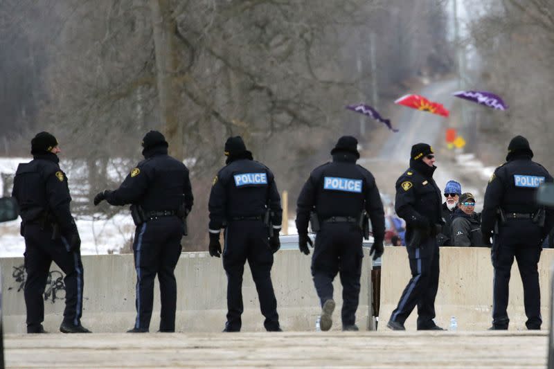 Ontario Provincial Police (OPP) officers guard the site of a dismantled Tyendinaga Mohawk Territory camp, in Tyendinaga