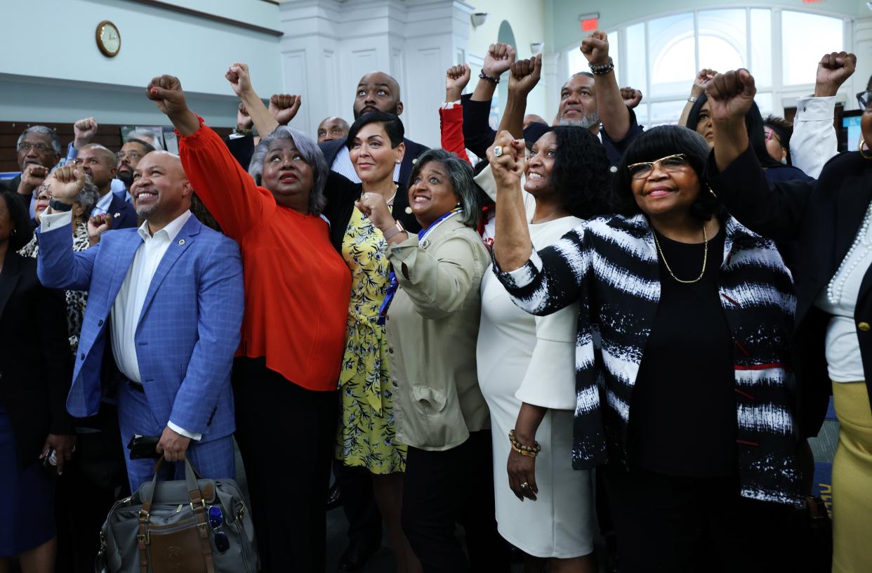 Members of the Texas Legislative Black Caucus pose for a photo as they visit the Kate Waller Barrett Branch Library, on 16 July 2021 in Alexandria, Virginia (Getty Images)