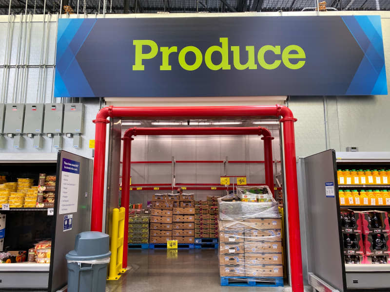 Orlando, FL/USA-8/6/20: The Produce sign above the refrigerated Produce room  at a Sam's Club warehouse store in Orlando, Florida.