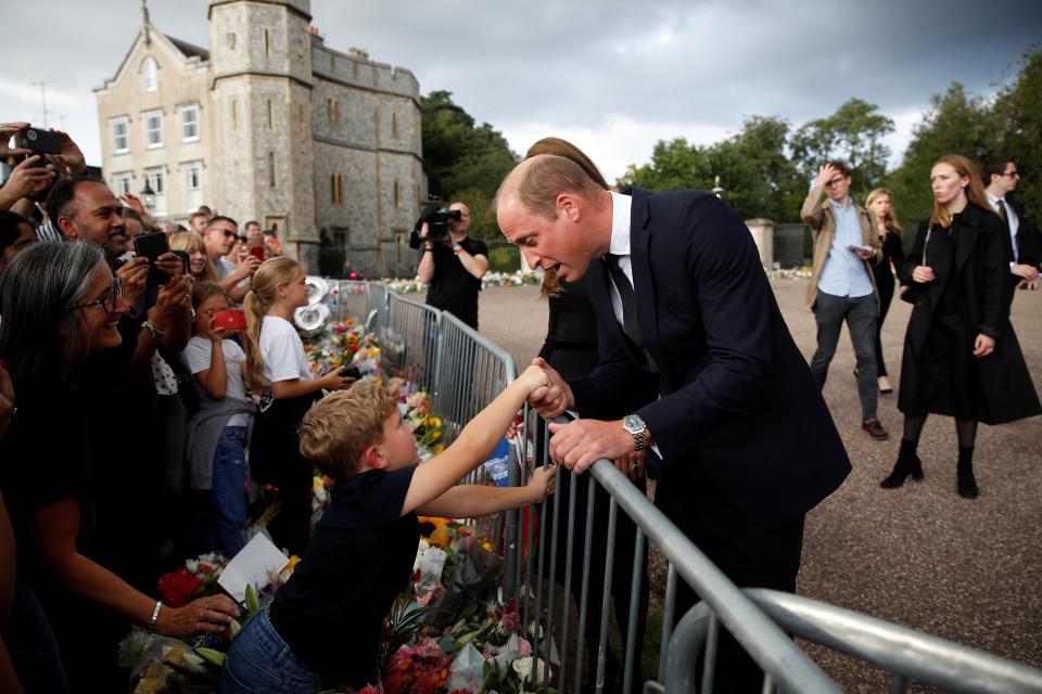 William, Prince of Wales greets members of the public, outside Windsor Castle (REUTERS)