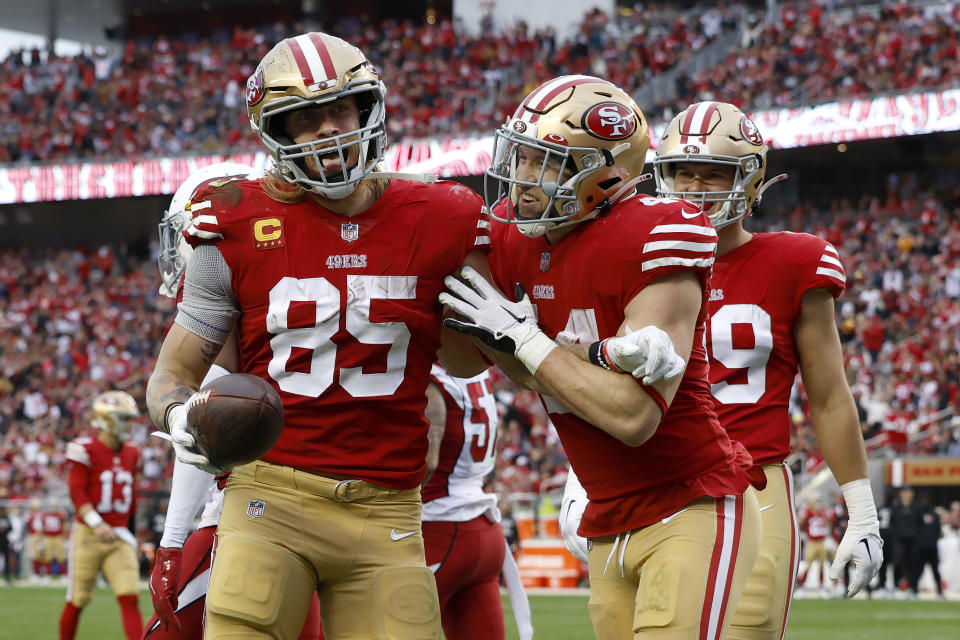 San Francisco 49ers tight end George Kittle (85) is congratulated by fullback Kyle Juszczyk after scoring against the Arizona Cardinals during the second half of an NFL football game in Santa Clara, Calif., Sunday, Jan. 8, 2023. (AP Photo/Jed Jacobsohn)