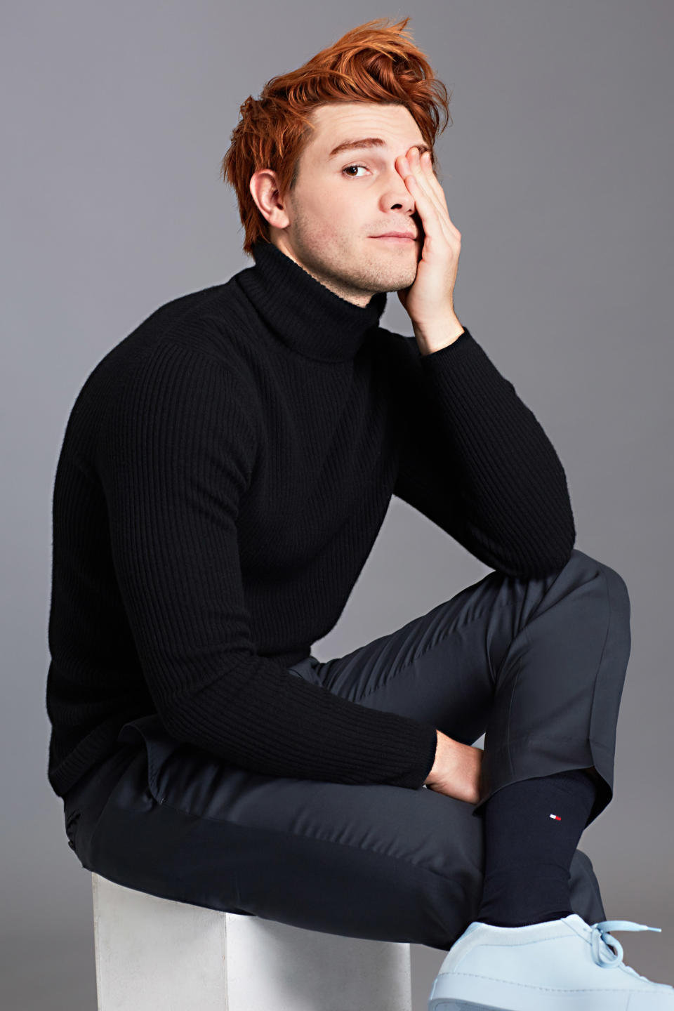 <p>Turtleneck sweater by Theory, trousers and socks by Tommy Hilfiger, sneakers by Koio.</p>