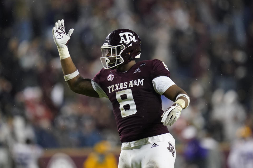 Texas A&M defensive lineman DeMarvin Leal gestures toward the crowd at Kyle Field before a third-down play by LSU during the first half of an NCAA college football game Saturday, Nov. 28, 2020, in College Station, Texas. (AP Photo/Sam Craft)