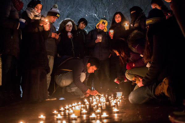 Students gathered at the Diag in memory of the three victims of the Chapel Hill shooting at the University of Michigan in Ann Arbor on Wednesday Feb. 11, 2015. 
