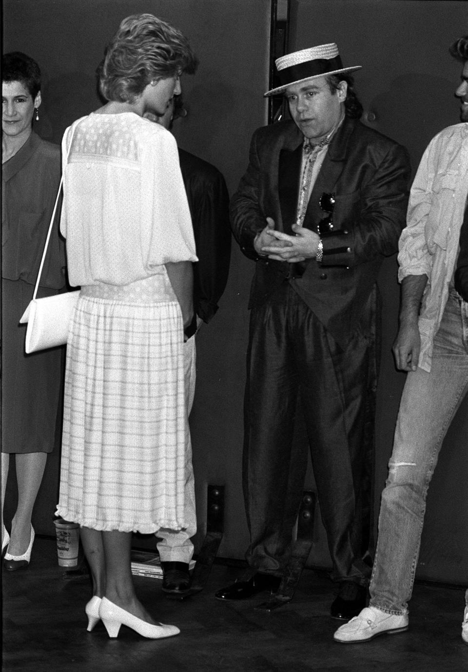 1985: The Princess of Wales opened the massive Live Aid concert in aid of the African famine at Wembley Stadium, London. She is pictured here with Elton John, one of the many artistes appearing in the transatlantic event.   (Photo by PA Images via Getty Images)