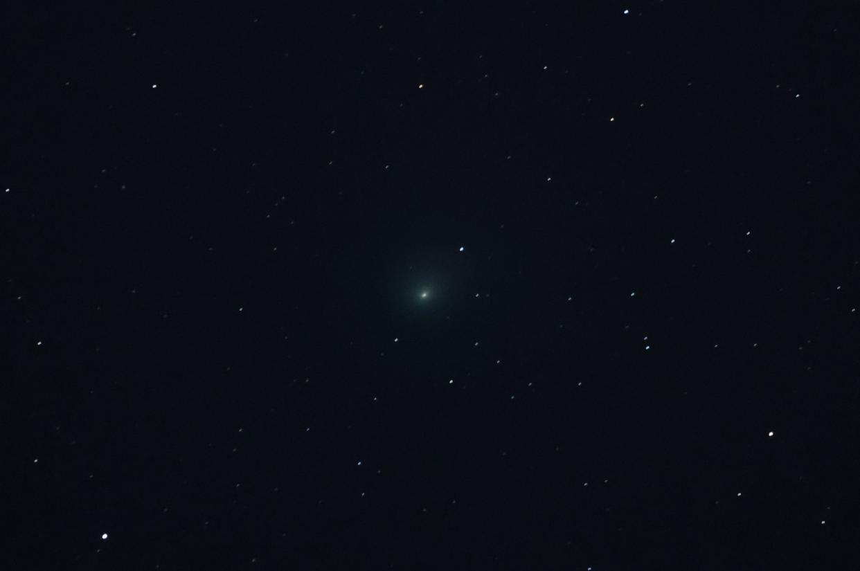 Comet C/2022 E3 (ZTF) is visible in the sky above the Mojave National Preserve in San Bernadino County as it approaches Earth for the first time in about 50,000 years on January 31, 2023 near Baker, California. The comet was discovered on March 2, 2022, and will be at its closest point to Earth on February 1, 2023. Its orbit extends far out into our solar system and has a green aura because it is passing close enough to the sun for the outgassing of its diatomic carbon molecules to react with the solar wind. (Getty Images)
