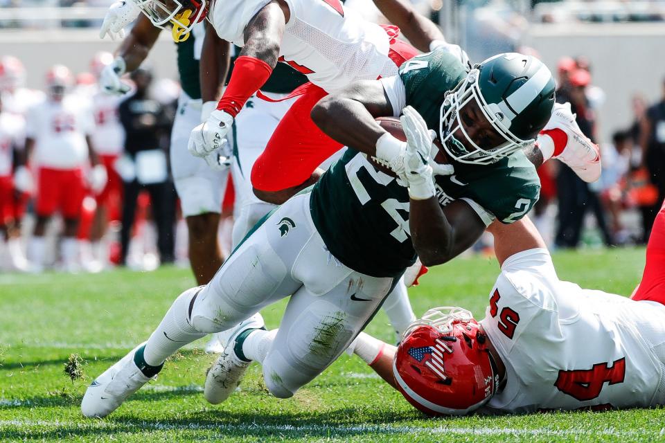 Michigan State running back Elijah Collins (24) runs for a touchdown against Youngstown State during the first half at Spartan Stadium in East Lansing on Saturday, Sept. 11, 2021.