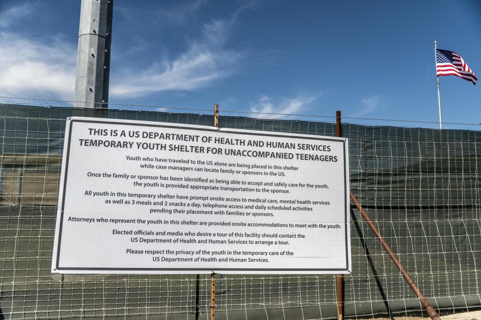 A sign outside of a Influx Care Facility (ICF) for unaccompanied children explains what the facility is on Sunday, February 21, 2021, in Carrizo Springs, Texas. / Credit: Sergio Flores/The Washington Post via Getty Images