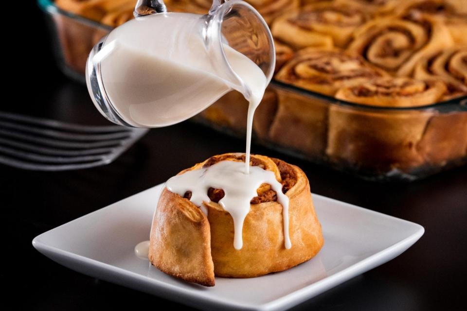 Sweet potato pecan roll with drizzling frosting.