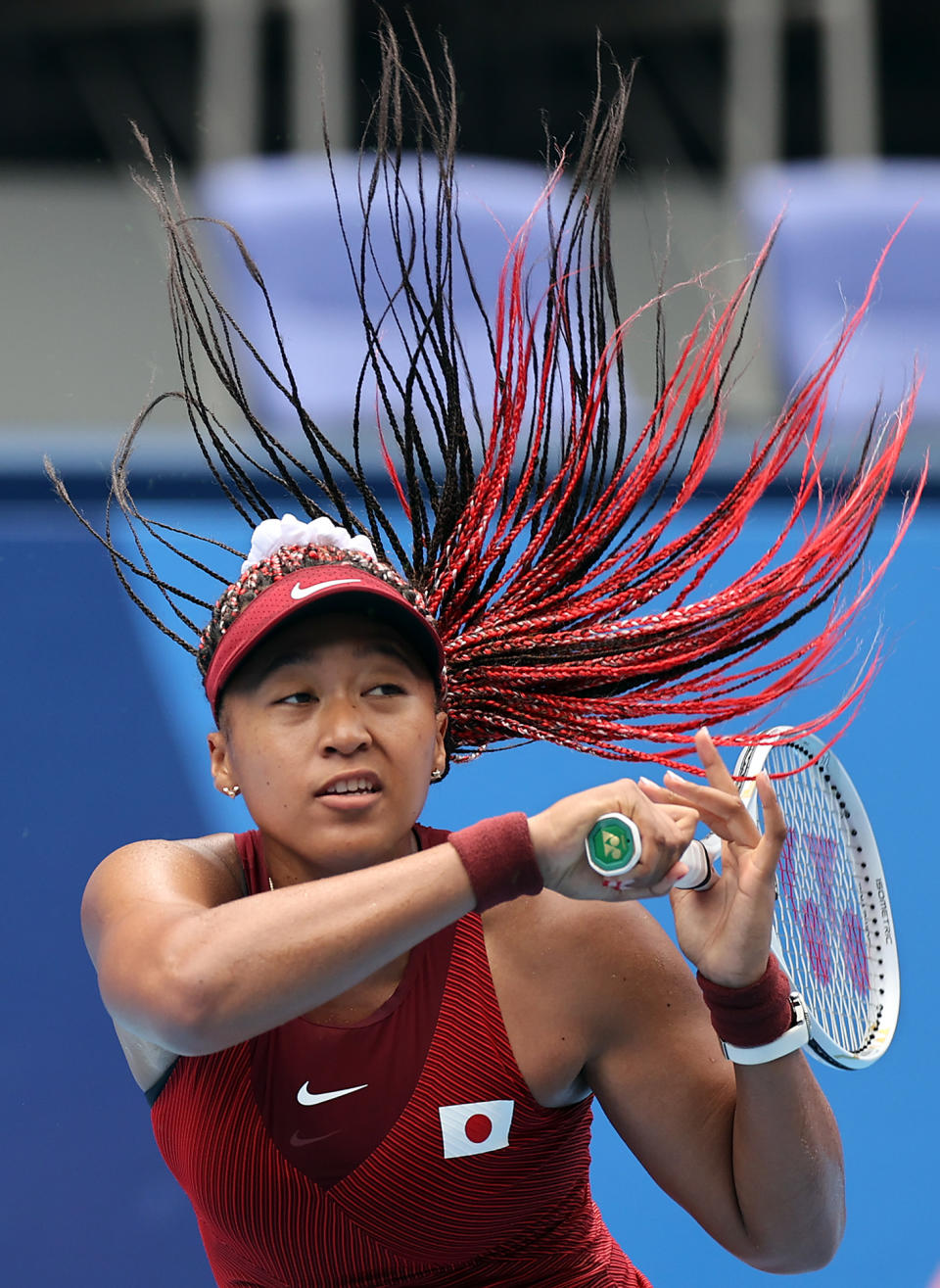 <p>Japan's Naomi Osaka is in motion during her women's singles second round match against Viktorija Golubic of Switzerland on July 26.</p>