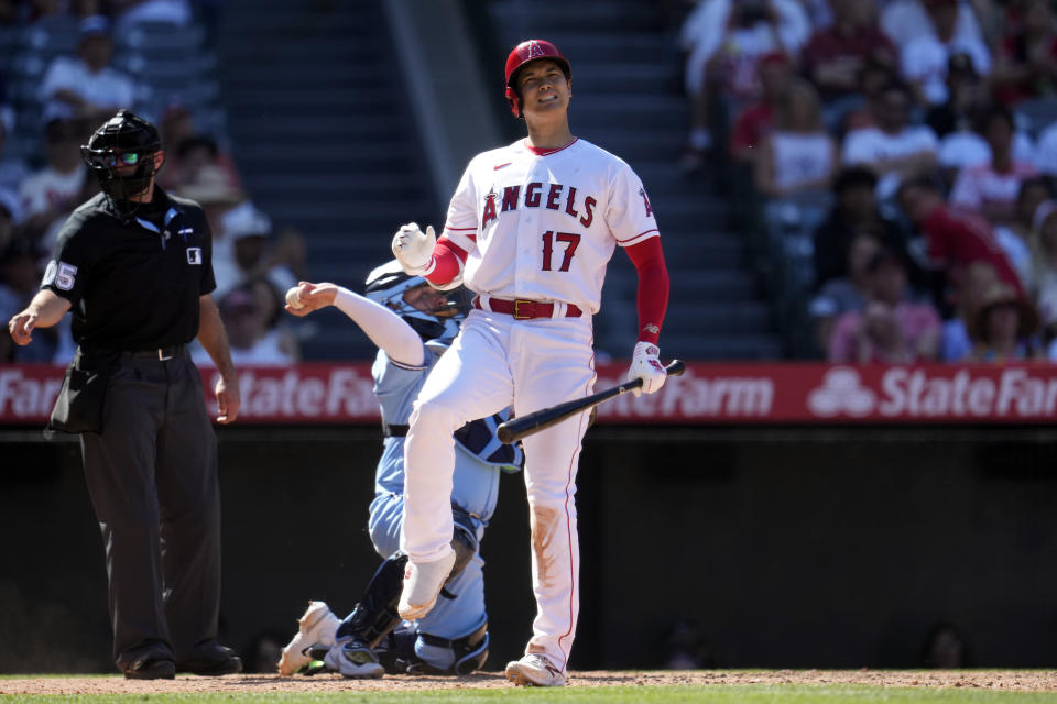 Los Angeles Angels' Shohei Ohtani reacts to a missed swing during the ninth inning of a baseball game against the Toronto Blue Jays Sunday, April 9, 2023, in Anaheim, Calif. (AP Photo/Marcio Jose Sanchez)