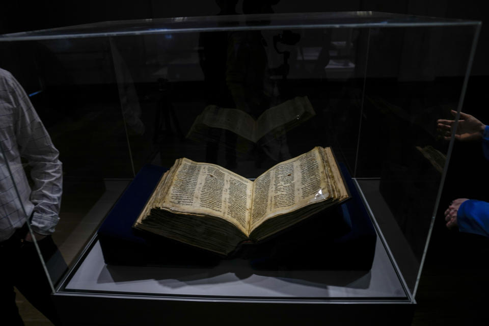 The Codex Sassoon 1,100-year-old Hebrew Bible is on display at the Tel Aviv's ANU Museum of the Jewish People for a week-long exhibition of the manuscript, part of a whirlwind worldwide tour of the artifact in the United Kingdom, Israel and the United States before its expected sale, Israel, Wednesday, March 22, 2023. One of the oldest surviving biblical manuscripts is up for sale — for a cool $30 million. The Codex Sassoon is a nearly complete 1,100-year-old Hebrew Bible. Sotheby's is putting it up for auction in New York in May for an estimated price of $30 million to $50 million. (AP Photo/Ariel Schalit)