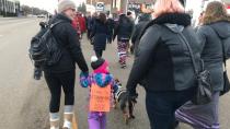 'The future is female': Regina girls march in solidarity with women around the world