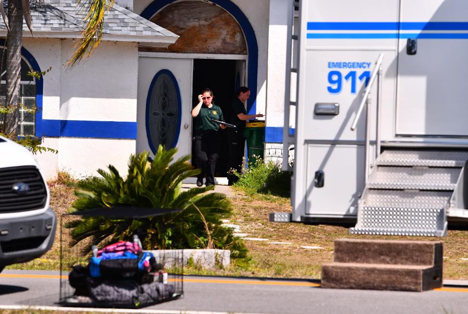 Heavy police presence on scene at 4075 Alan Shepard Ave. In Canaveral Groves, investigating four homicides.