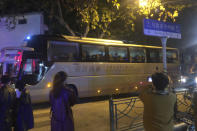 In this photo obtained by The Associated Press, protesters are taken away by police in a bus in Shanghai on Saturday, Nov. 26, 2022. Protests against China’s restrictive COVID measures appeared in a number of cities Saturday night, in displays of public defiance fanned by anger over a deadly fire in the western Xinjiang region. (AP Photo)