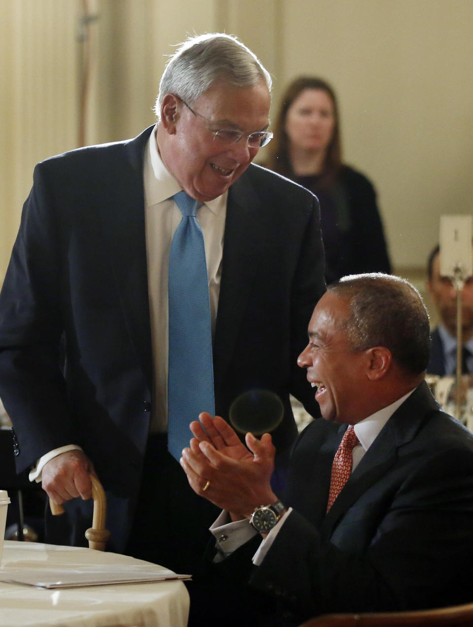 Mass. Gov. Deval Patrick applauds as former Boston Mayor Thomas Menino gets up to speak at a forum entitled, "Leading Cities Through Crisis: Lessons from the Boston Marathon" held at Boston University in Boston, Monday, March 24, 2014. (AP Photo/Elise Amendola)