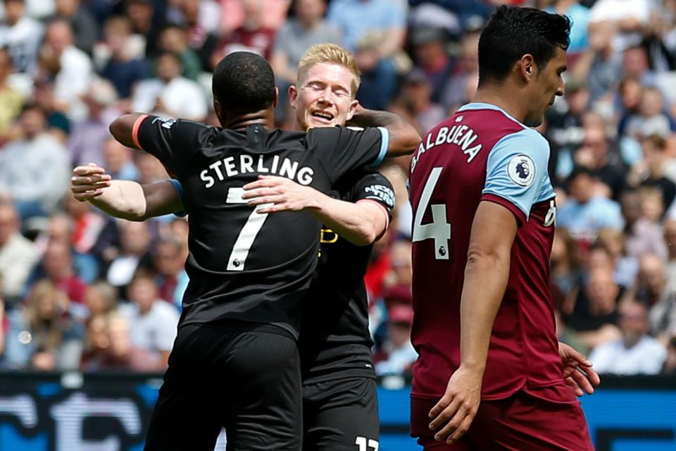 Manchester City's English midfielder Raheem Sterling (L) celebrates with Manchester City's Belgian midfielder Kevin De Bruyne (2L) after scoring their second goal during the English Premier League football match between West Ham United and Manchester City at The London Stadium, in east London on August 10, 2019. (Photo by Ian KINGTON / AFP) / RESTRICTED TO EDITORIAL USE. No use with unauthorized audio, video, data, fixture lists, club/league logos or 'live' services. Online in-match use limited to 120 images. An additional 40 images may be used in extra time. No video emulation. Social media in-match use limited to 120 images. An additional 40 images may be used in extra time. No use in betting publications, games or single club/league/player publications. /         (Photo credit should read IAN KINGTON/AFP/Getty Images)